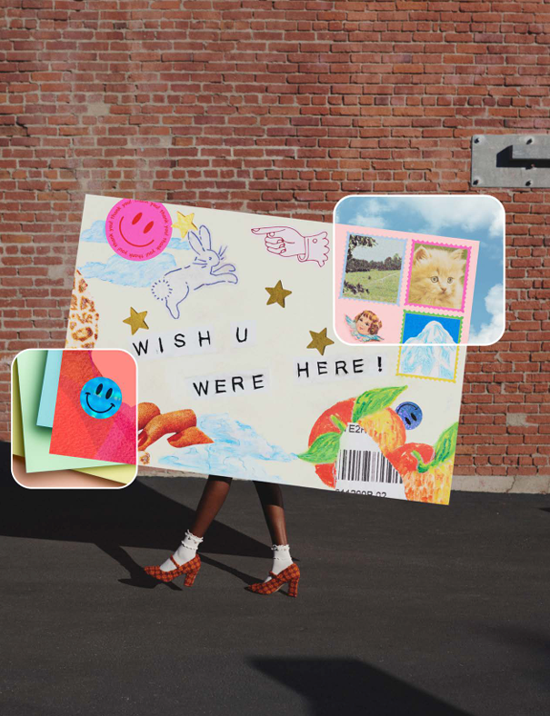 Large cutout of a postcard with the words "WISH U WERE HERE" being carried by someone.