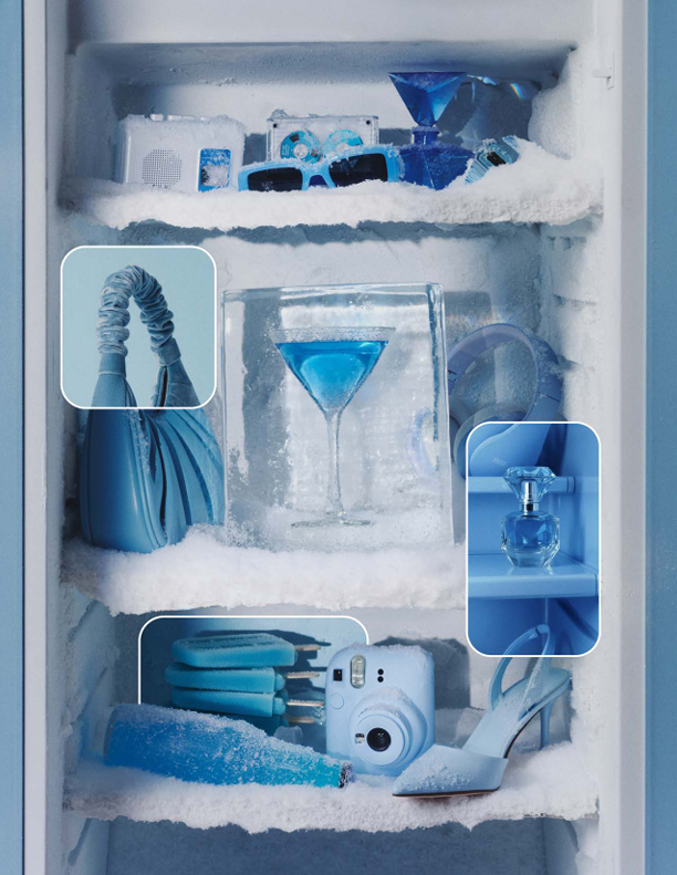 An icy freezer filled with an assortment of blue-hued items and beverages.